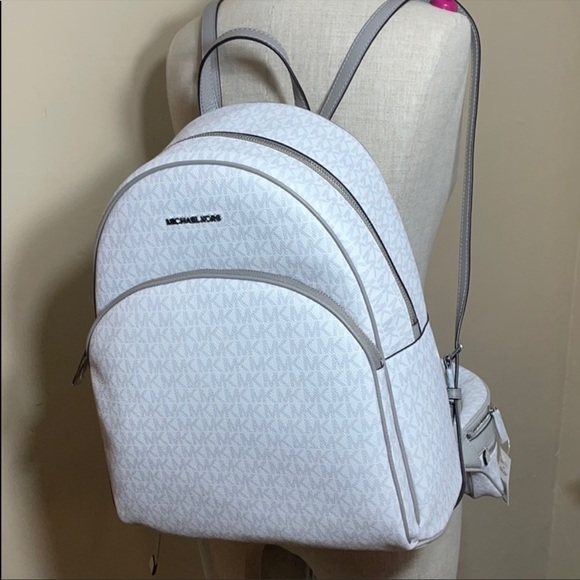 Michael Kors Handbags - Michael Kors Backpack bright white signature